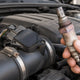 P0174 Bank 2 lean vs both banks lean: hand holding an O2 sensor next to the MAF intake tube