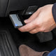 OBD2 code reader guide: plugging a Diagnostic Tool adapter into the OBD2 port under the dashboard